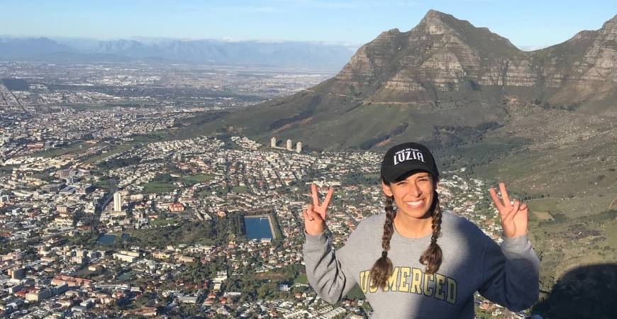 UC Merced student posing on Lion's Head near Cape Town, South Africa