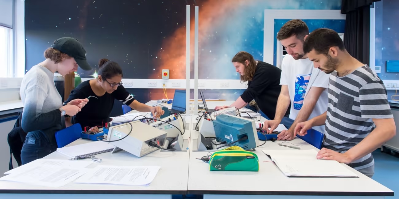 Summer Physics header of students in a lab